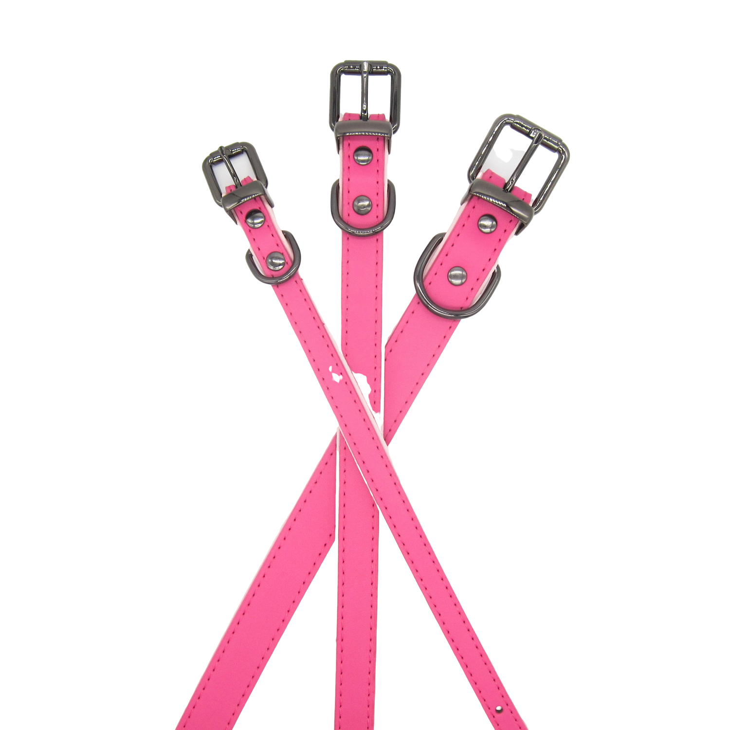 Stacked pink leather collars in small, medium, and large