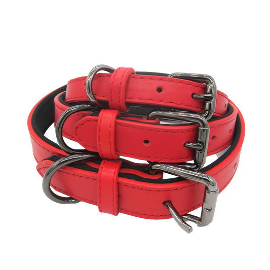 Stacked red leather collars in small, medium, and large